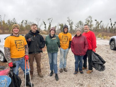 Volunteers with clean-up tools prepare to get to work in Blair