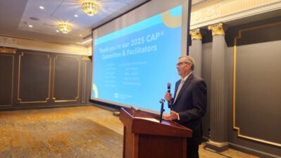 Mark Weber speaks at a podium at the 2025 CAP graduation February, 2026.